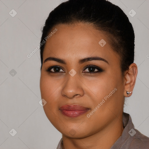 Joyful latino young-adult female with short  brown hair and brown eyes