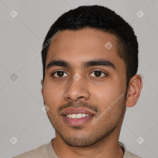 Joyful latino young-adult male with short  black hair and brown eyes