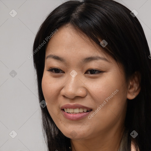 Joyful asian young-adult female with long  brown hair and brown eyes