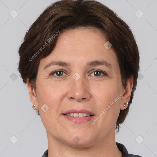 Joyful white adult female with short  brown hair and brown eyes