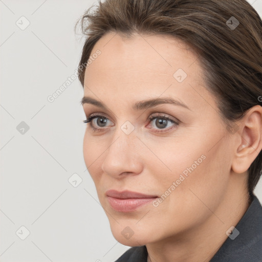 Neutral white young-adult female with medium  brown hair and brown eyes