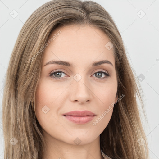 Joyful white young-adult female with long  brown hair and green eyes