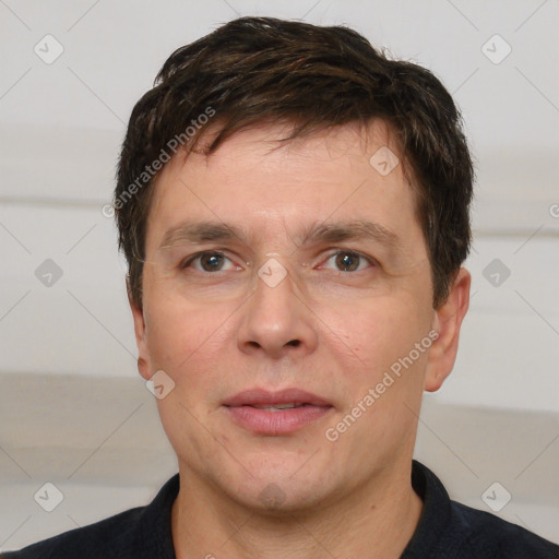 Joyful white adult male with short  brown hair and brown eyes