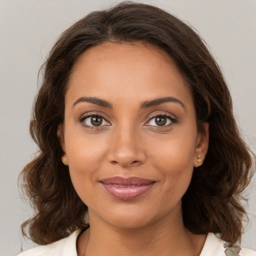 Joyful white young-adult female with medium  brown hair and brown eyes