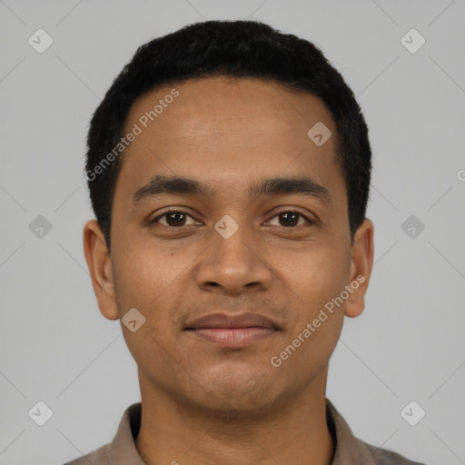 Joyful latino young-adult male with short  black hair and brown eyes