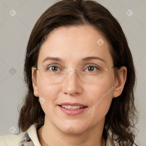 Joyful white adult female with medium  brown hair and grey eyes