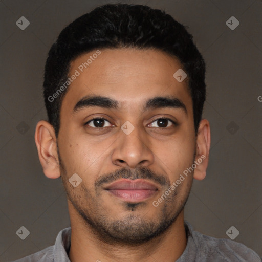 Joyful latino young-adult male with short  brown hair and brown eyes