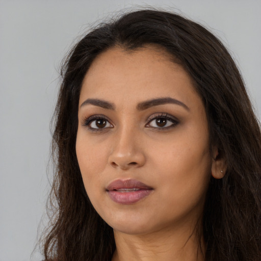 Neutral latino young-adult female with long  brown hair and brown eyes