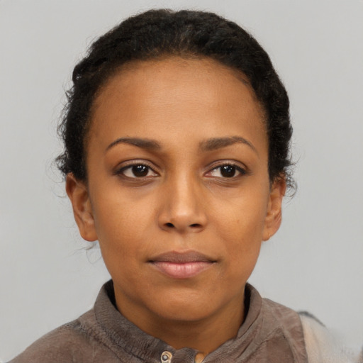Neutral black young-adult female with short  brown hair and brown eyes