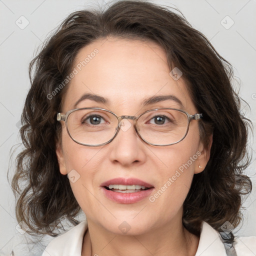 Joyful white adult female with medium  brown hair and blue eyes