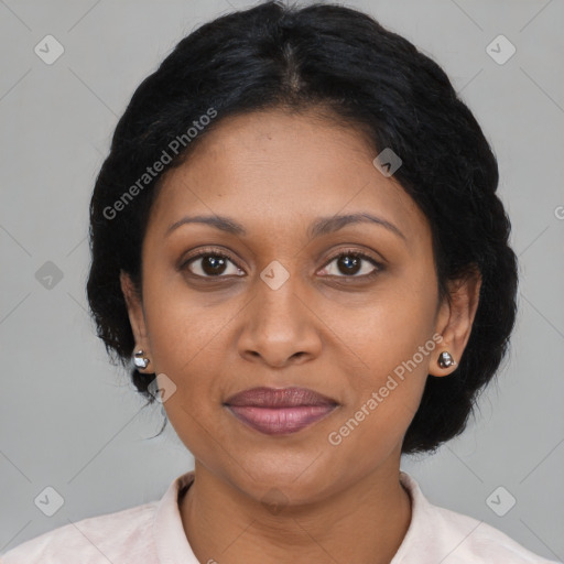 Joyful black adult female with medium  brown hair and brown eyes