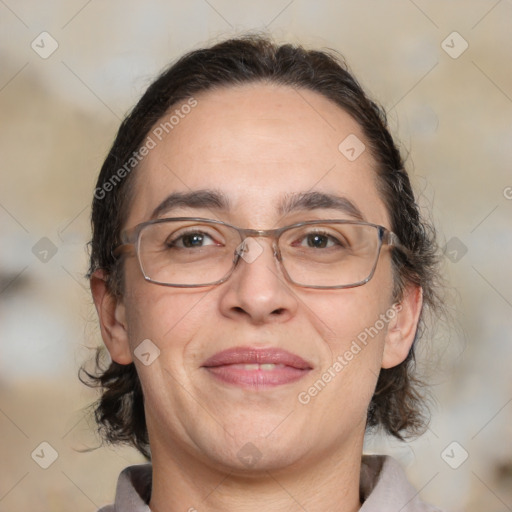 Joyful white adult female with medium  brown hair and brown eyes