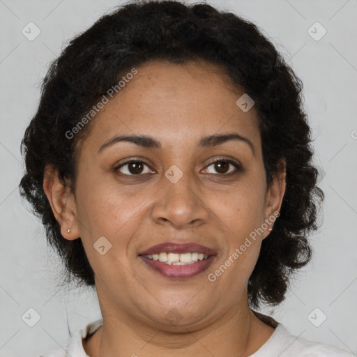 Joyful black adult female with short  brown hair and brown eyes