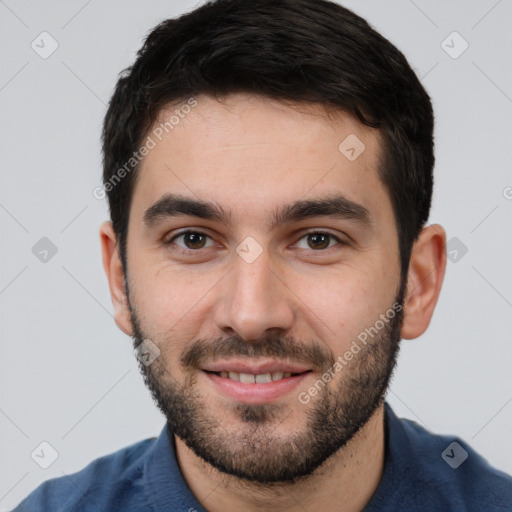 Joyful white young-adult male with short  black hair and brown eyes