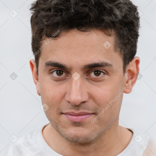 Joyful white young-adult male with short  brown hair and brown eyes