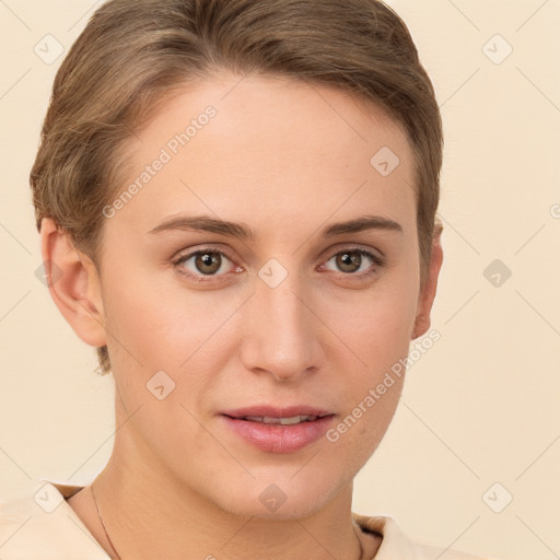 Joyful white young-adult female with short  brown hair and grey eyes