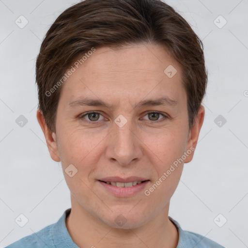 Joyful white adult female with short  brown hair and grey eyes