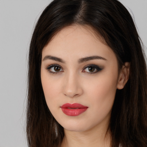 Neutral white young-adult female with long  brown hair and brown eyes