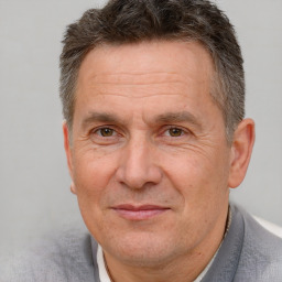 Joyful white middle-aged male with short  brown hair and brown eyes