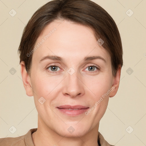 Joyful white adult female with short  brown hair and grey eyes