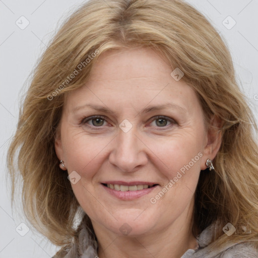 Joyful white adult female with medium  brown hair and grey eyes