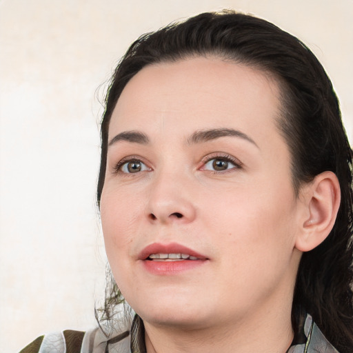 Joyful white young-adult female with medium  black hair and brown eyes