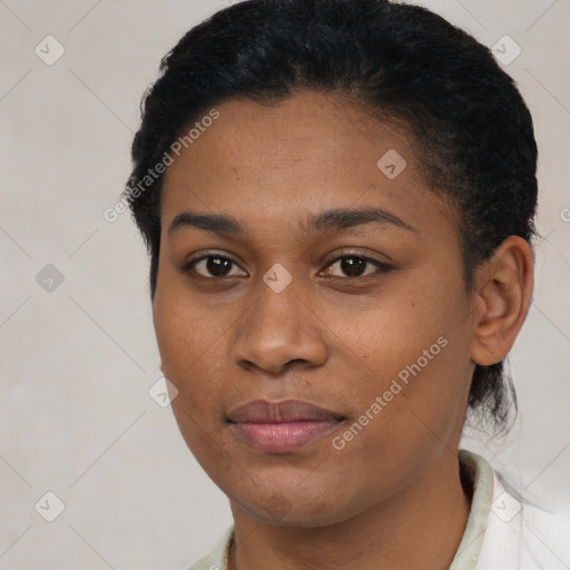 Joyful black young-adult female with short  black hair and brown eyes