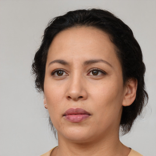 Neutral latino adult female with medium  black hair and brown eyes