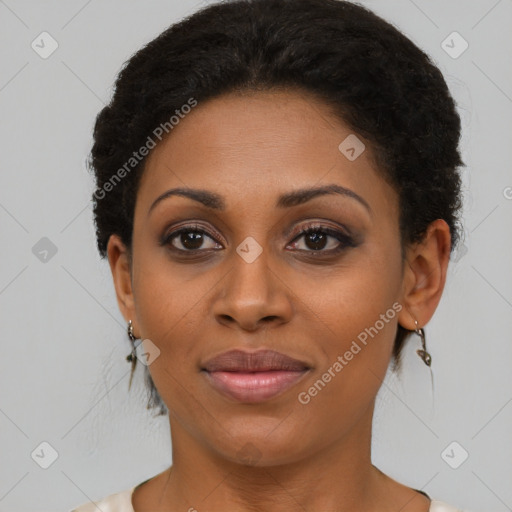 Joyful black young-adult female with short  brown hair and brown eyes