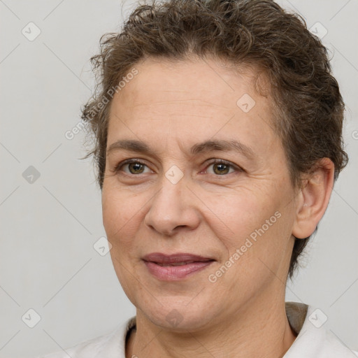 Joyful white adult female with short  brown hair and brown eyes