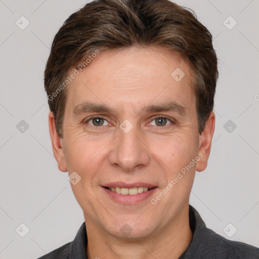 Joyful white adult male with short  brown hair and grey eyes