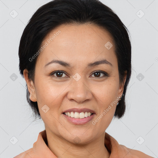 Joyful latino adult female with medium  brown hair and brown eyes