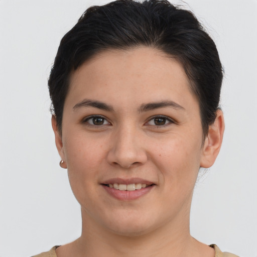 Joyful white young-adult female with short  brown hair and brown eyes