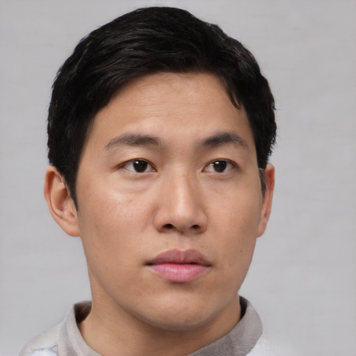Neutral asian young-adult male with short  black hair and brown eyes