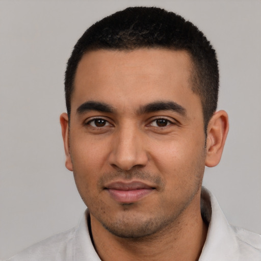 Neutral latino young-adult male with short  black hair and brown eyes