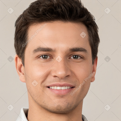 Joyful white young-adult male with short  brown hair and brown eyes