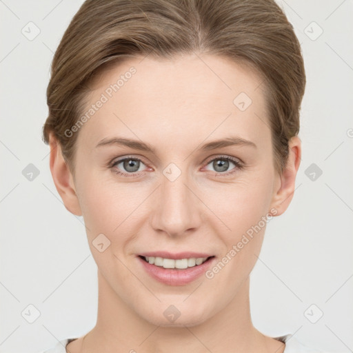 Joyful white young-adult female with short  brown hair and grey eyes