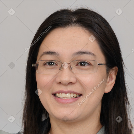 Joyful white adult female with long  brown hair and brown eyes