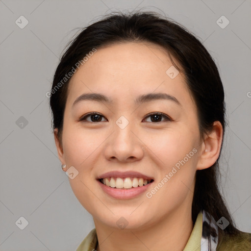 Joyful asian young-adult female with medium  brown hair and brown eyes