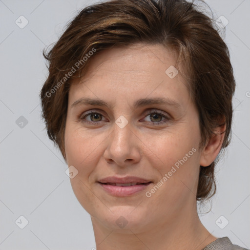 Joyful white adult female with short  brown hair and brown eyes