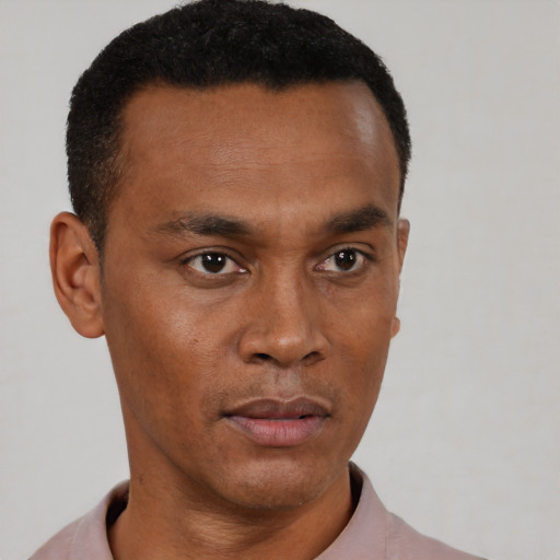 Neutral black adult male with short  black hair and brown eyes