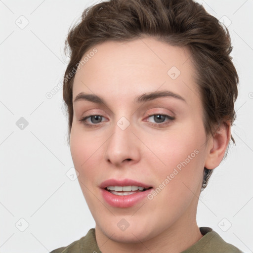 Joyful white young-adult female with medium  brown hair and green eyes