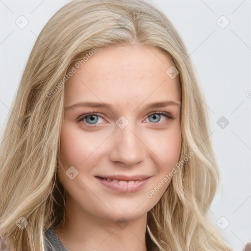 Joyful white young-adult female with long  brown hair and blue eyes