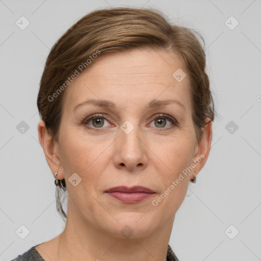 Joyful white adult female with medium  brown hair and grey eyes