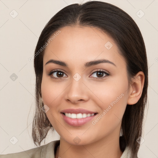 Joyful white young-adult female with long  brown hair and brown eyes