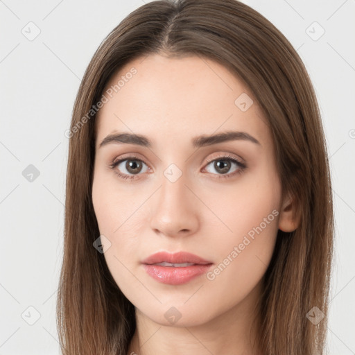 Neutral white young-adult female with long  brown hair and brown eyes