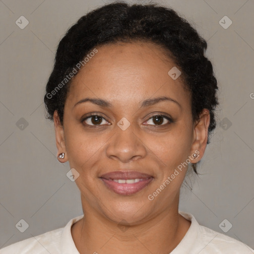 Joyful black adult female with short  brown hair and brown eyes