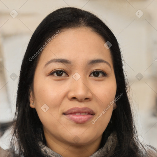 Joyful latino young-adult female with long  brown hair and brown eyes