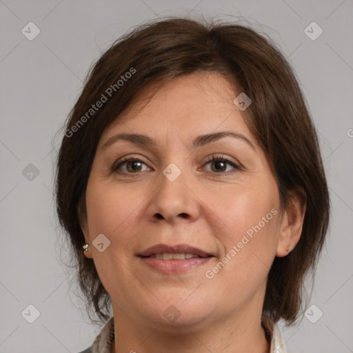 Joyful white adult female with medium  brown hair and brown eyes