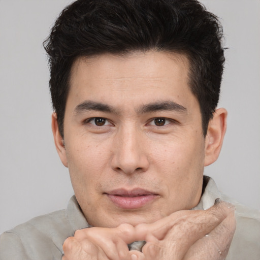 Neutral asian young-adult male with short  brown hair and brown eyes